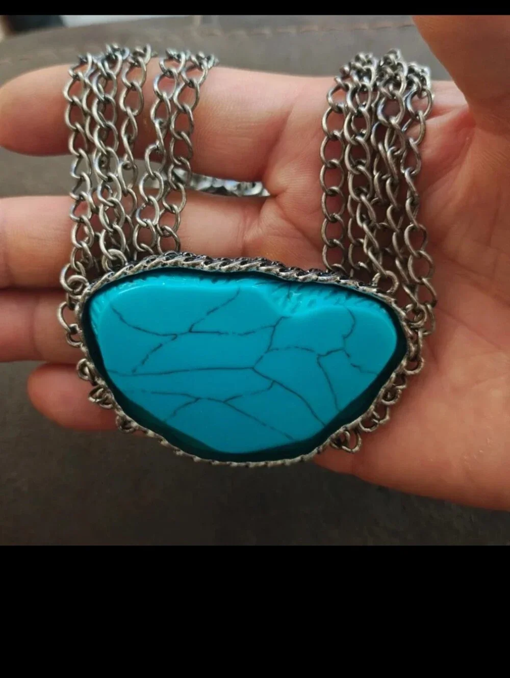 Silver Tone Multi Strand Chain Statement Necklace With a Faux Turquoise Stone